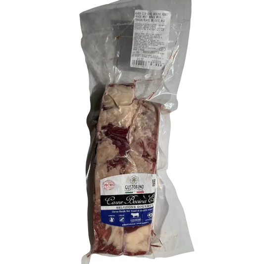 Packaged meat with a label on a white background